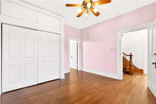 a view of an entryway with wooden floor