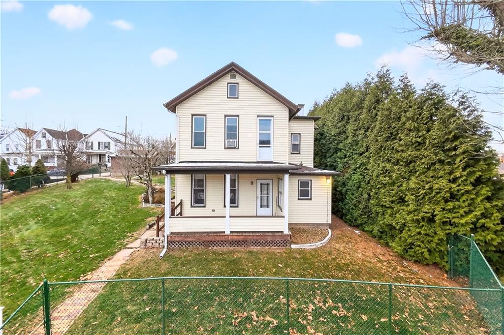 136 1/2 Chess Street Monongahela, PA 15063 - Photo 2 of 50 a view of a white house with a yard table and chairs