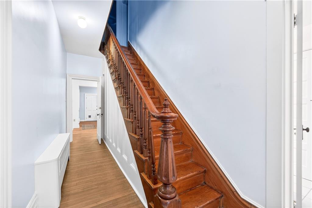 136 1/2 Chess Street Monongahela, PA 15063 - Photo 23 of 50 a view of a hallway with wooden floor and stairs