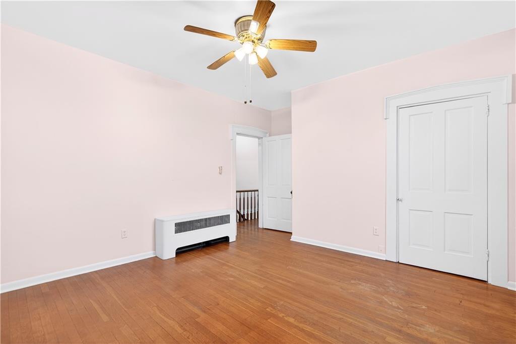 136 1/2 Chess Street Monongahela, PA 15063 - Photo 31 of 50 an empty room with a window and a ceiling fan