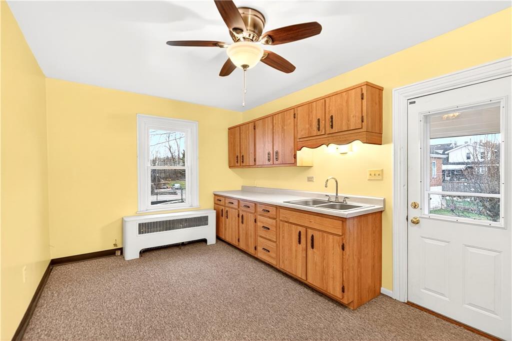 136 1/2 Chess Street Monongahela, PA 15063 - Photo 34 of 50 a kitchen with stainless steel appliances granite countertop a stove and a sink