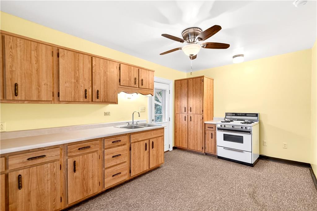 136 1/2 Chess Street Monongahela, PA 15063 - Photo 35 of 50 a kitchen with granite countertop a sink stainless steel appliances and cabinets