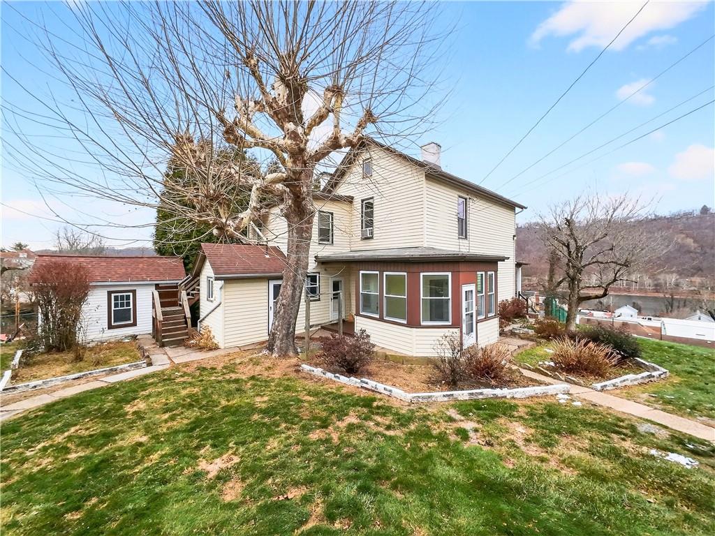 136 1/2 Chess Street Monongahela, PA 15063 - Photo 4 of 50 a front view of a house with a yard