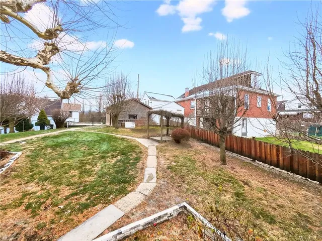 a view of a street with a building in the background
