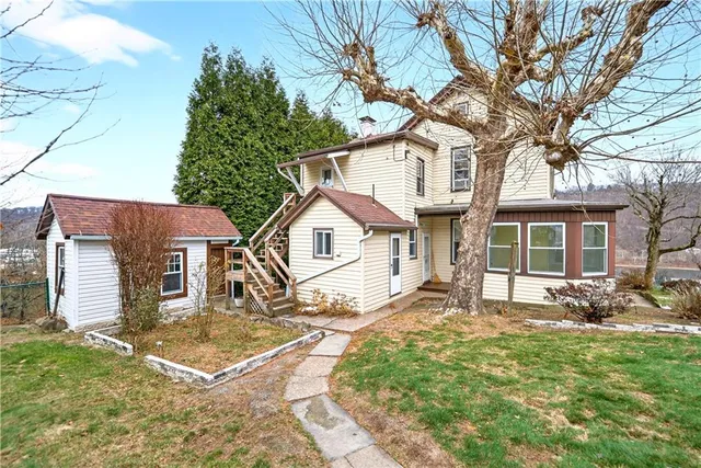 a front view of a house with a yard