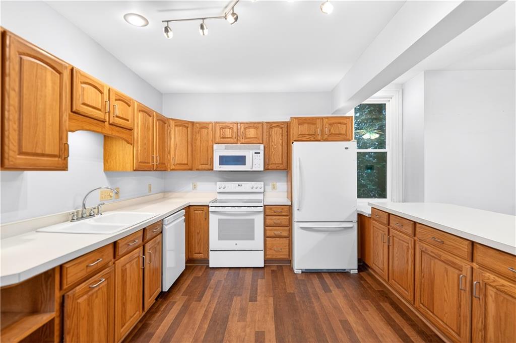 136 1/2 Chess Street Monongahela, PA 15063 - Photo 9 of 50 a kitchen with a refrigerator sink and wooden cabinets