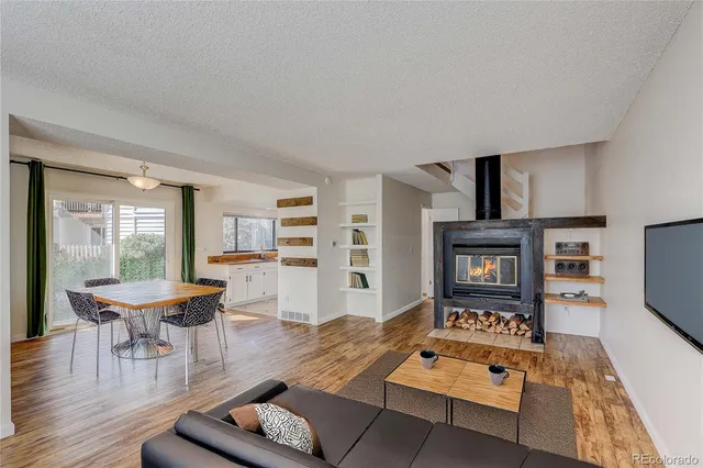 a living room with furniture and a rug