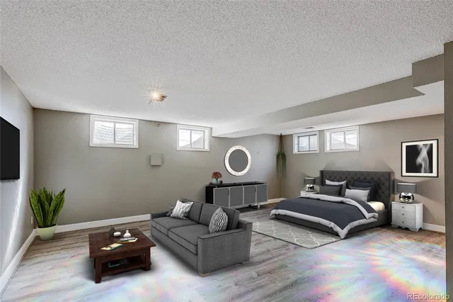 a bedroom with a bed mirror and a window