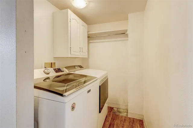a bathroom with a sink a toilet and shower curtain
