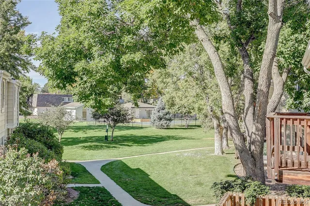 a view of a house with a yard and a bike