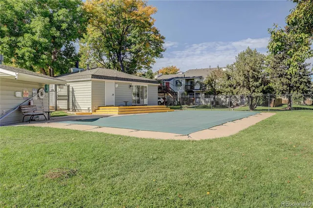 a view of a lake with houses in the back