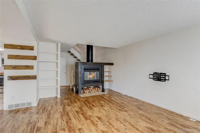 a room with a bed and furniture