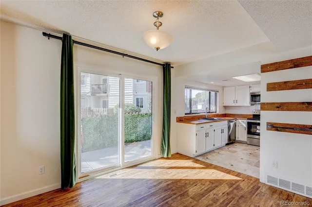 a room with a bed furniture and wooden floor