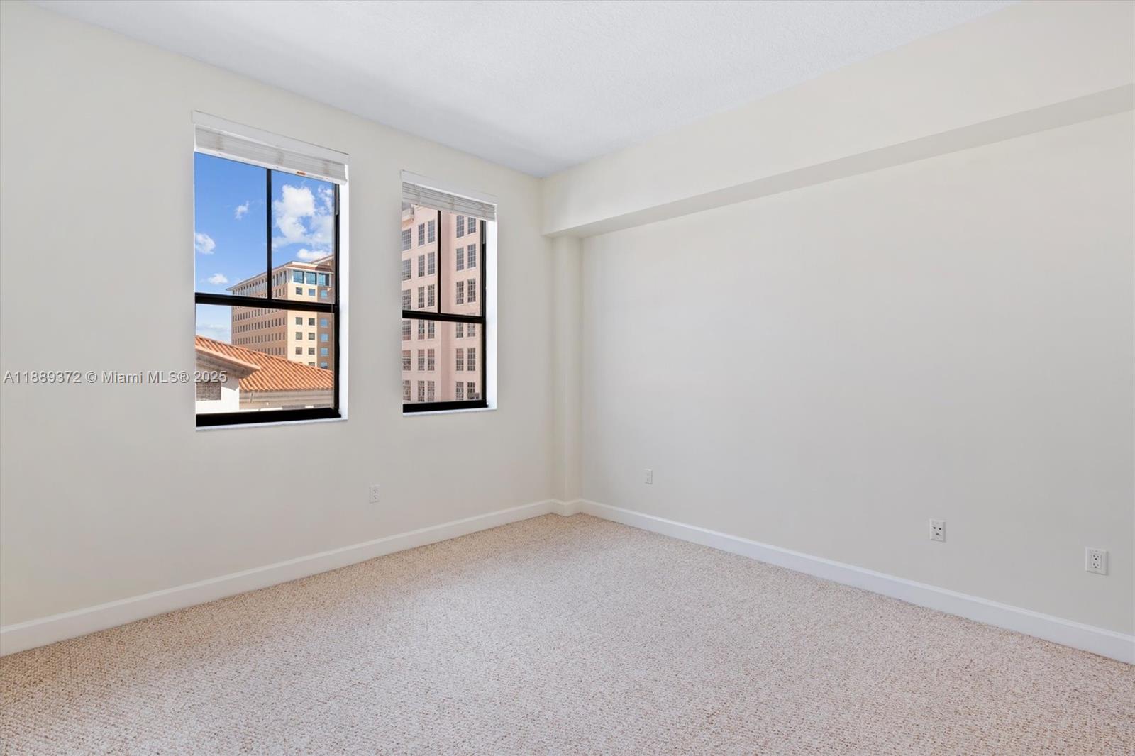 55 Merrick Way, Unit 814 Coral Gables, FL 33134 - Photo 11 of 39 an empty room with windows