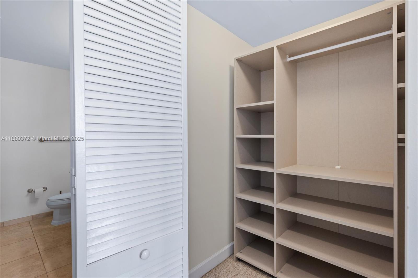 55 Merrick Way, Unit 814 Coral Gables, FL 33134 - Photo 16 of 39 a view of closet area with empty racks