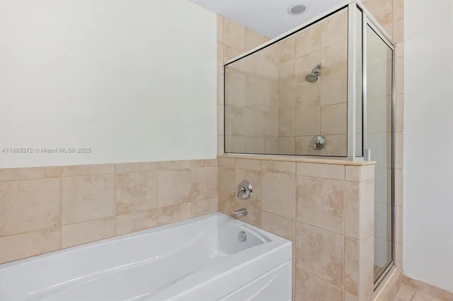 a view of a patio with couches table and chairs and potted plants