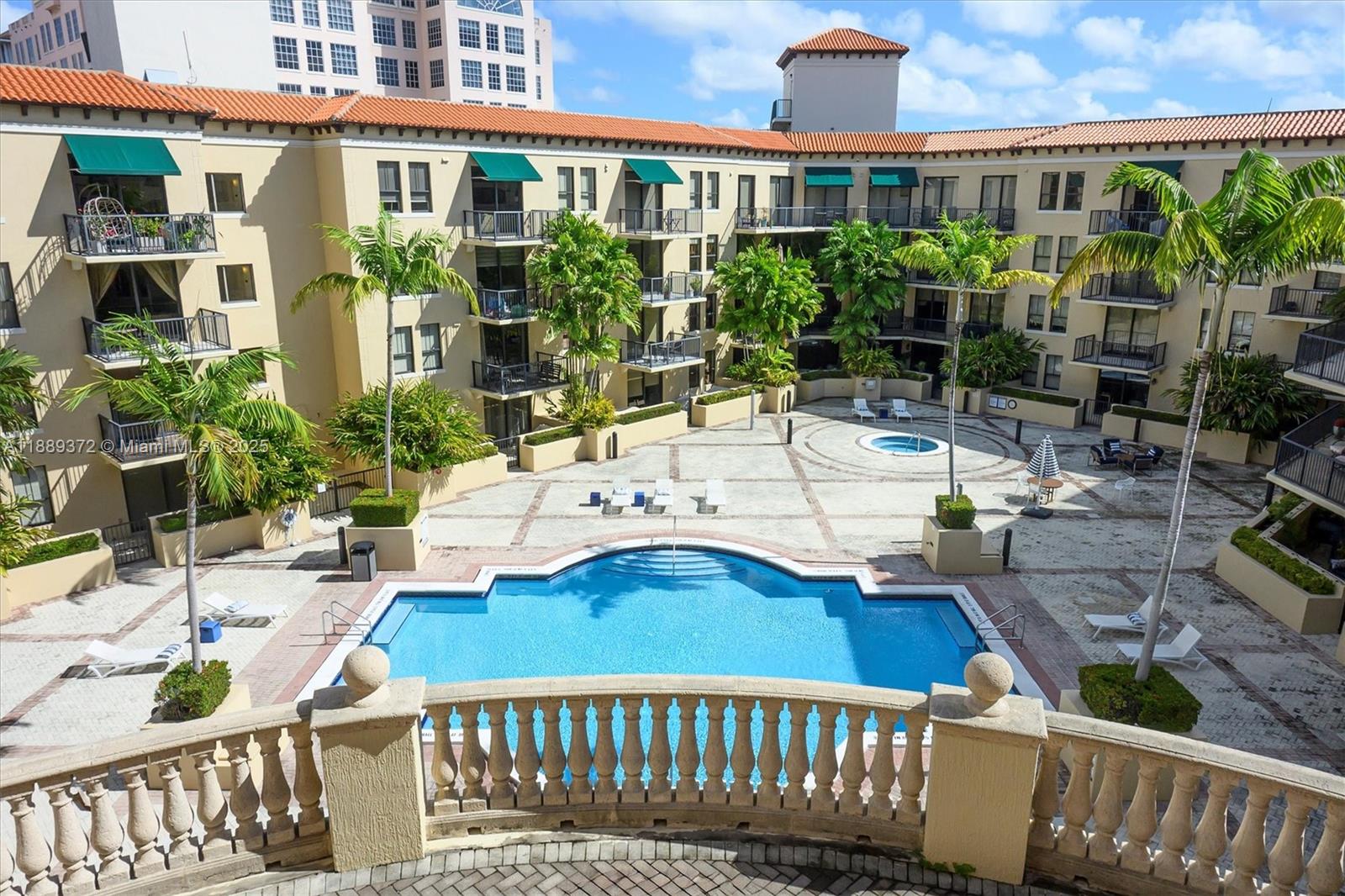 55 Merrick Way, Unit 814 Coral Gables, FL 33134 - Photo 20 of 39 a view of a patio with couches table and chairs and potted plants