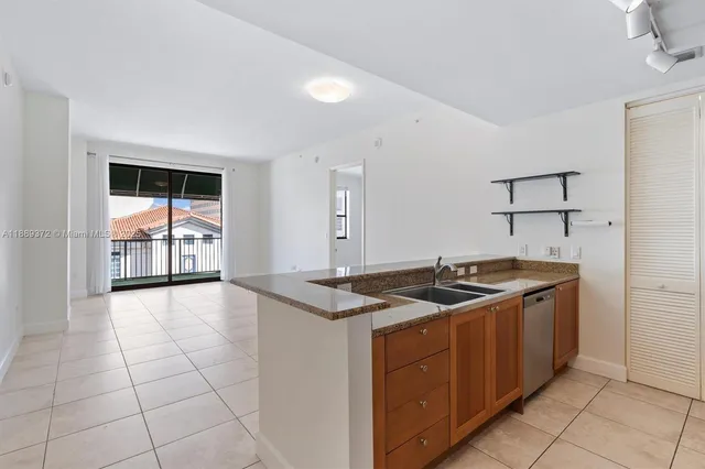 a kitchen with a stove and a sink