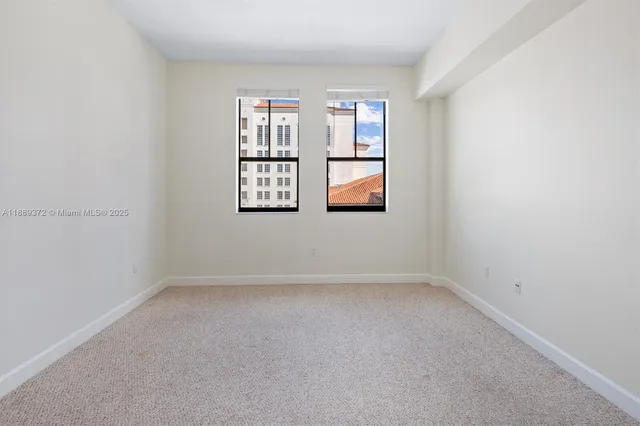 a view of an empty room and closet