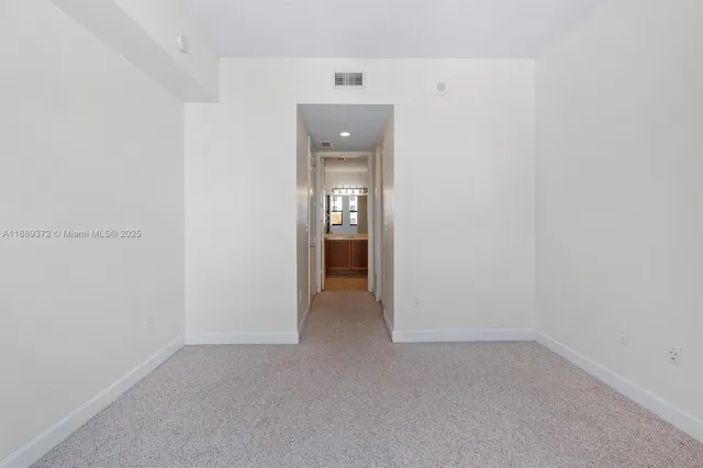 a bathroom with a granite countertop sink a toilet and bathtub