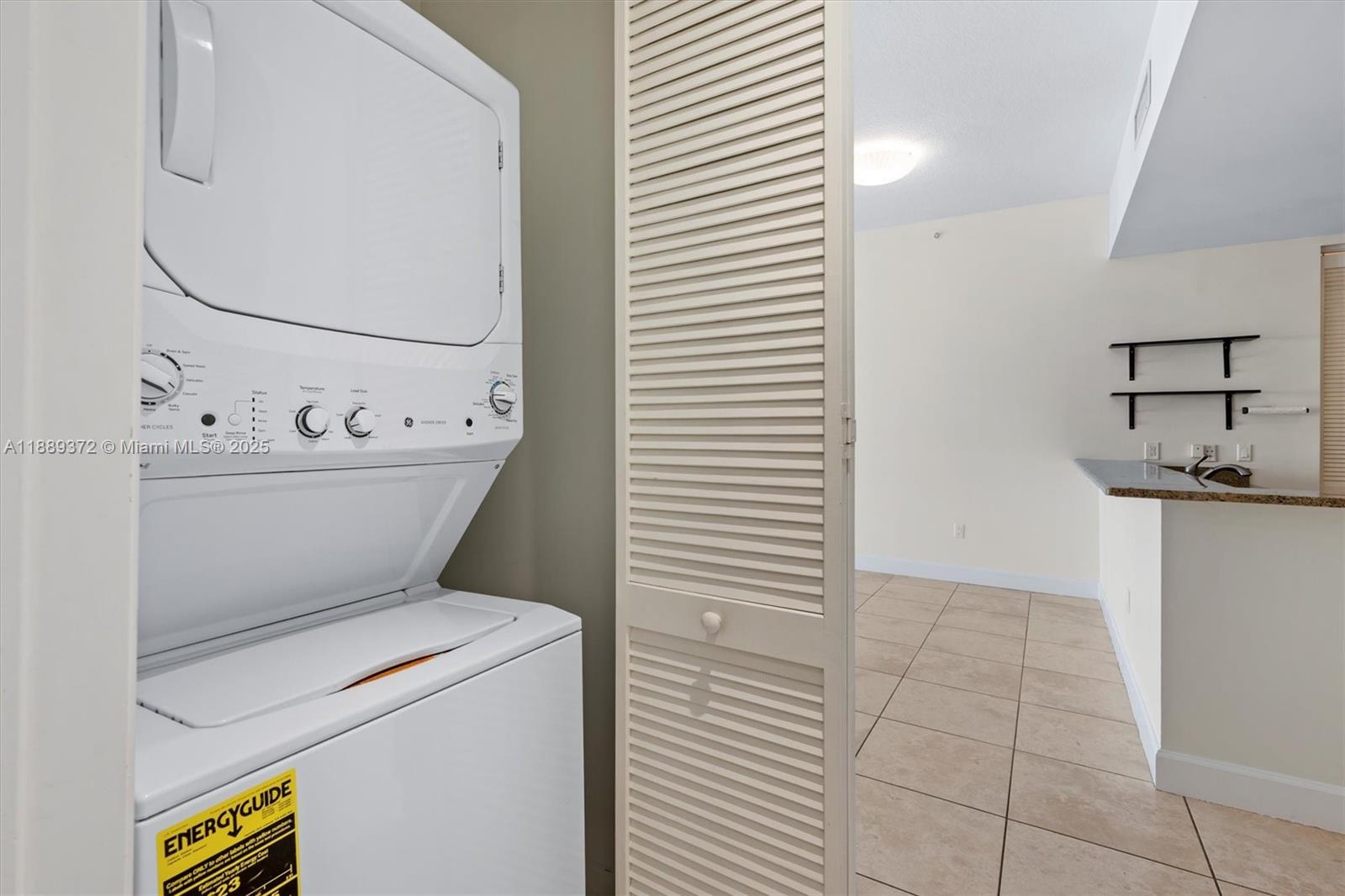 55 Merrick Way, Unit 814 Coral Gables, FL 33134 - Photo 27 of 39 a bathroom with a granite countertop sink a toilet and bathtub