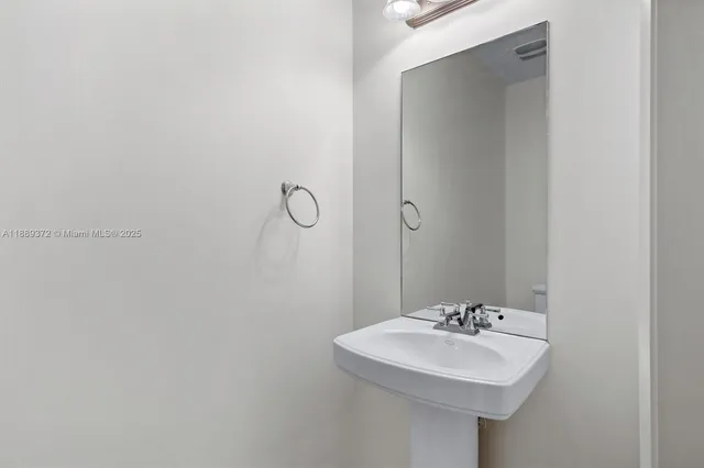 a kitchen with stainless steel appliances a refrigerator and a stove top oven