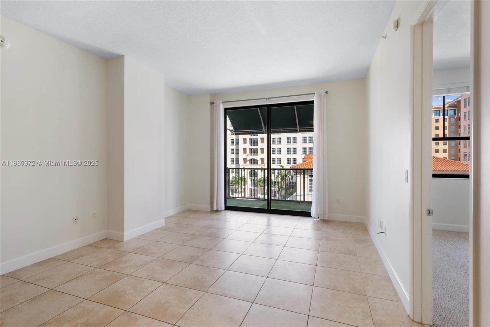 55 Merrick Way, Unit 814 Coral Gables, FL 33134 - Photo 3 of 39 a view of an empty room with a window