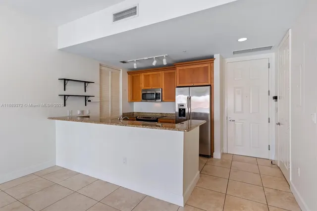 a view of a livingroom with furniture and a chandelier