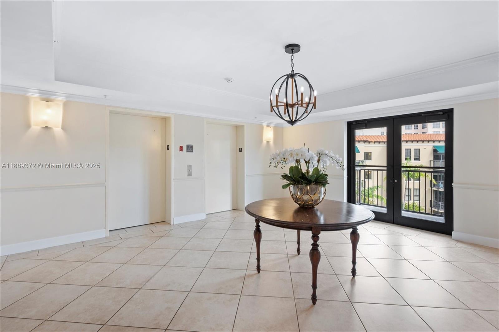 55 Merrick Way, Unit 814 Coral Gables, FL 33134 - Photo 33 of 39 a view of a livingroom with furniture and a chandelier