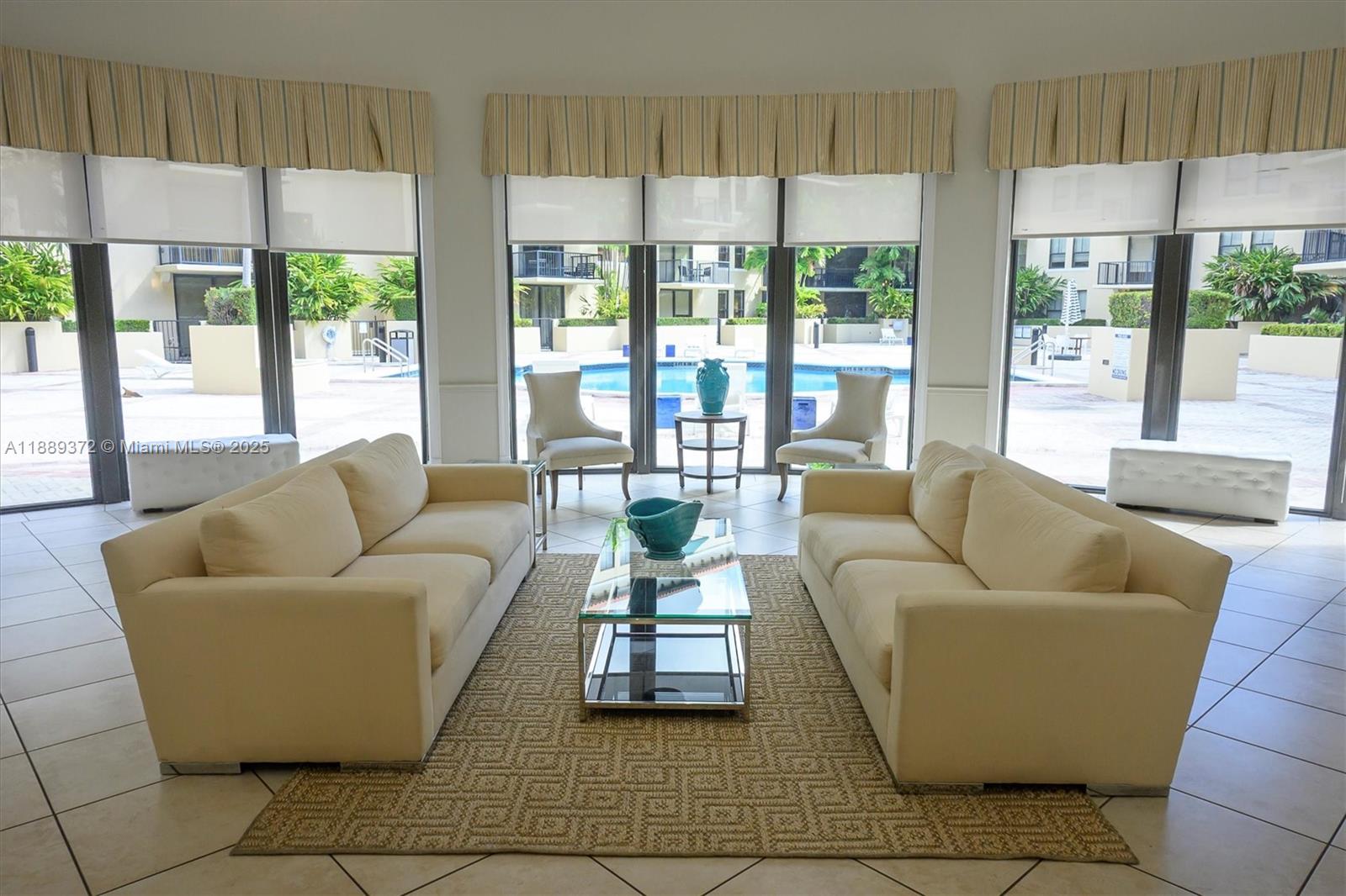 55 Merrick Way, Unit 814 Coral Gables, FL 33134 - Photo 34 of 39 a living room with furniture and a large window