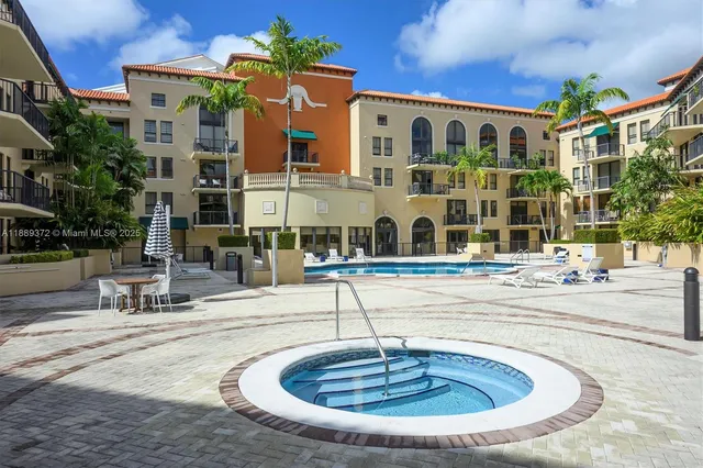 a couple of cars parked in front of brick building