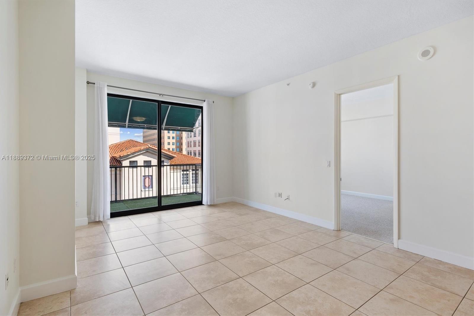 55 Merrick Way, Unit 814 Coral Gables, FL 33134 - Photo 7 of 39 an empty room with windows