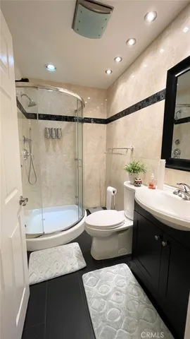 a bathroom with a double vanity sink and mirror