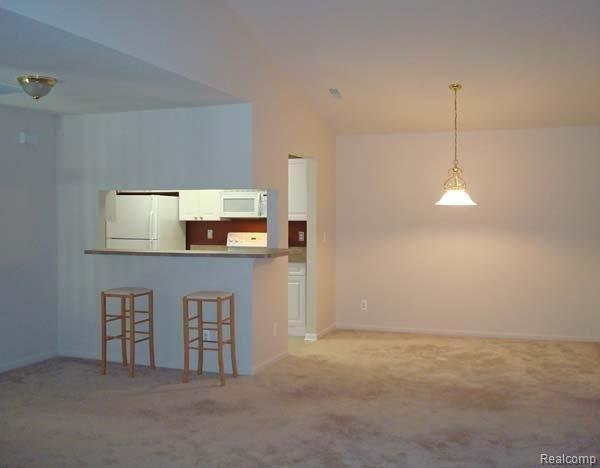 5366 Brookemonte Circle, Unit 365 Rochester, MI 48306 - Photo 4 of 17 Web_Great_Room_and_Kitchen_View-