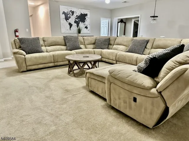 a living room with furniture and a couch