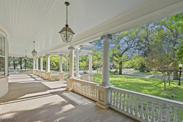 a view of a room with wooden floor and outdoor space