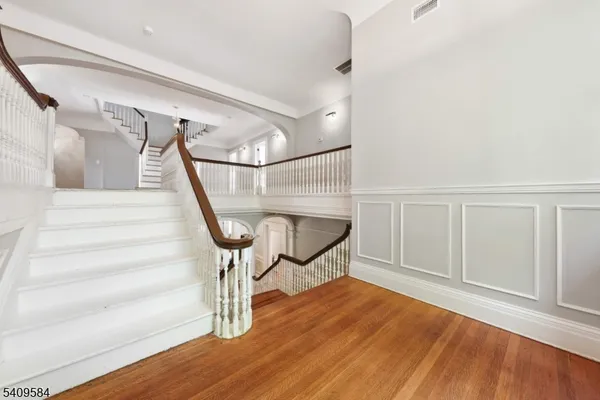 a view of entryway with wooden floor