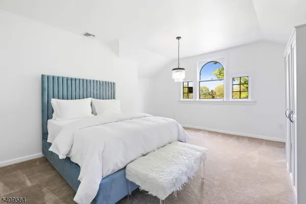 a bedroom with bed and window