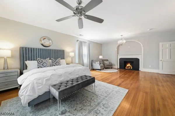 a bed room with a bed and a fireplace