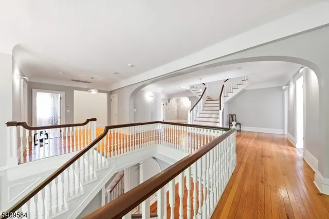 a view of staircase with wooden floor