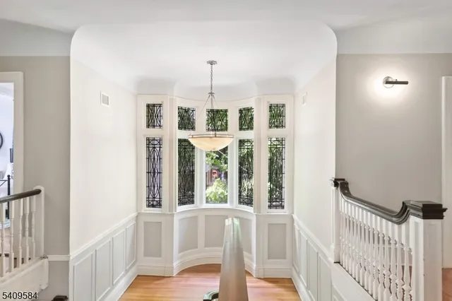 a view of a porch with wooden floor and windows