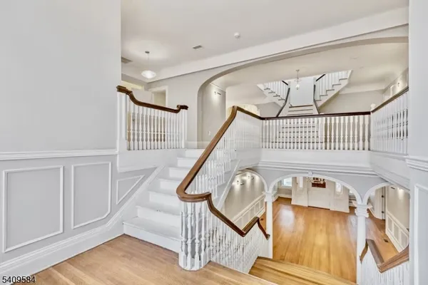 a view of front door with deck and furniture