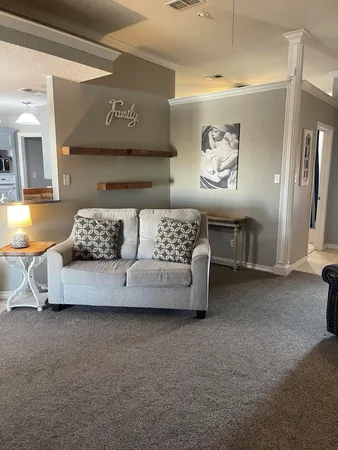 a living room with furniture and a couch