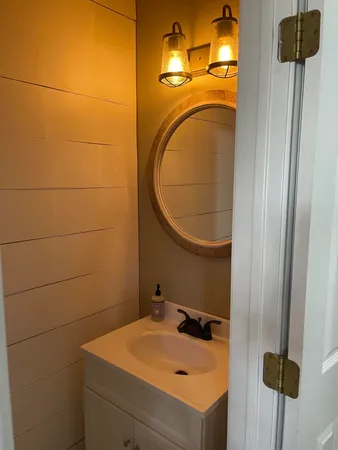 a white toilet sitting next to a sink