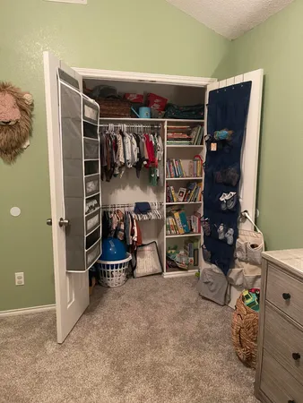 a bed room with a bed and a television
