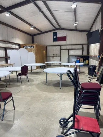 a living room with furniture gym equipment and a chandelier