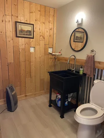 a backyard of a house with a table and chairs