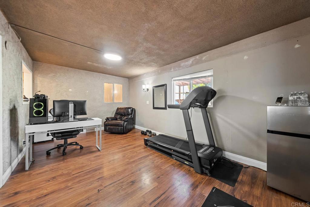 10981 Santa Cruz Road Desert Hot Springs, CA 92240 - Photo 13 of 43 a view of a room with gym equipment