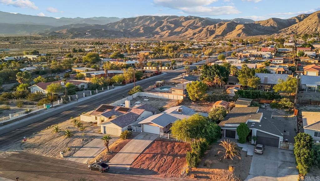 10981 Santa Cruz Road Desert Hot Springs, CA 92240 - Photo 35 of 43 an aerial view of residential houses with outdoor space