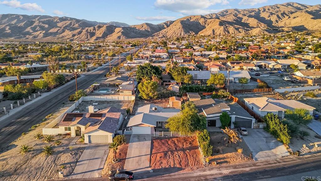 10981 Santa Cruz Road Desert Hot Springs, CA 92240 - Photo 36 of 43 an aerial view of residential houses with outdoor space